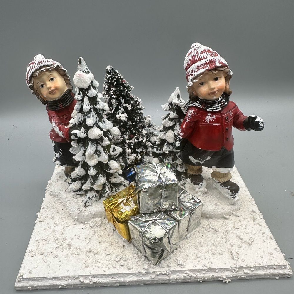 Vintage snow people playing in the snow Christmas scene